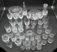 An extensive collection of glass to include cut crystal, drinking glasses, decanters, comports, wine