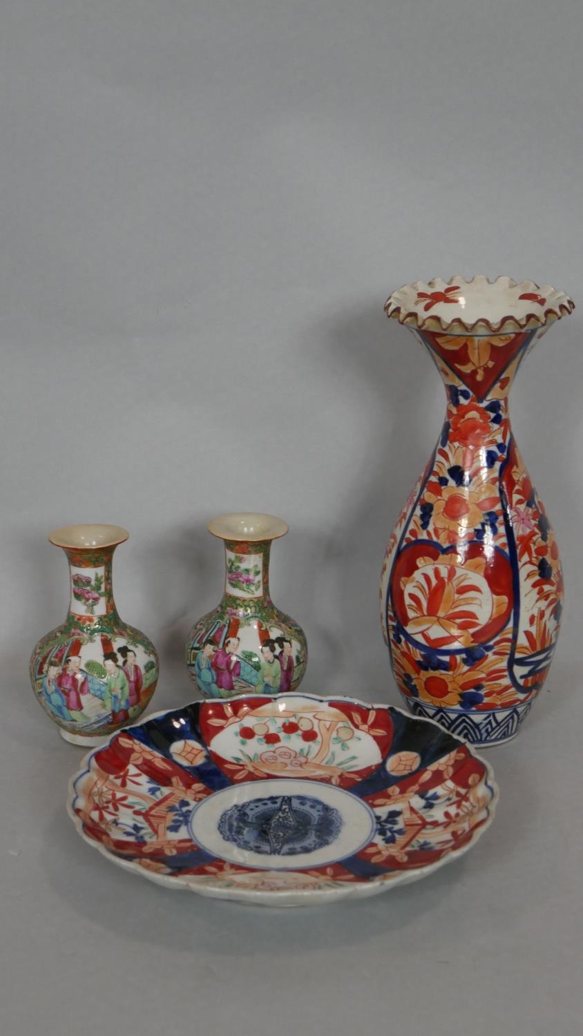 An Imari style plate and a similar vase with flared neck along with a pair of Famille Vert bulbous