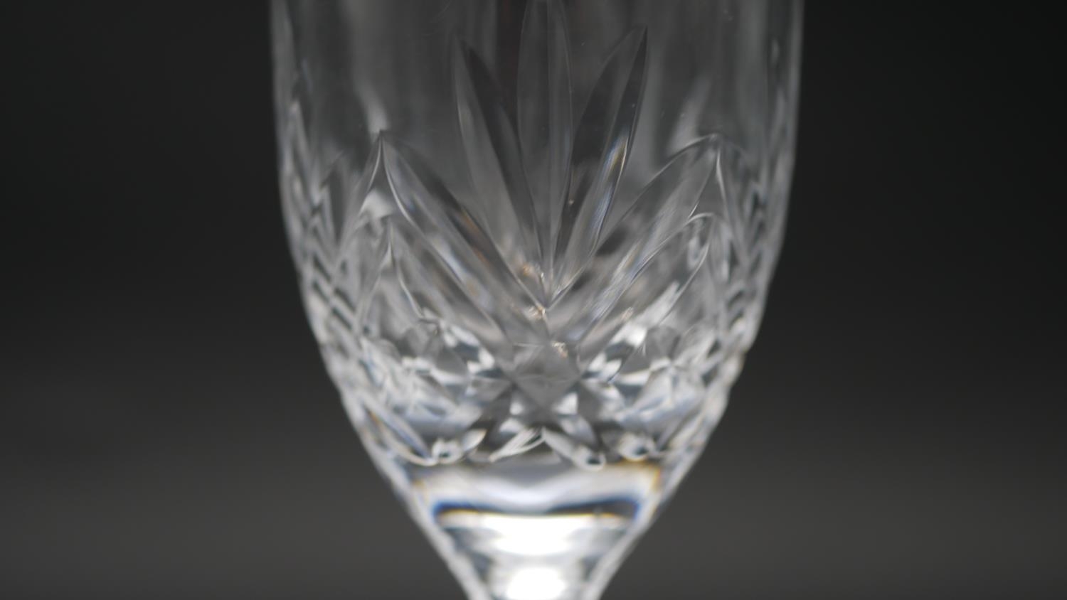 A collection of sixteen cut crystal glasses. Including a set of four foliate design wine glasses, - Image 8 of 11