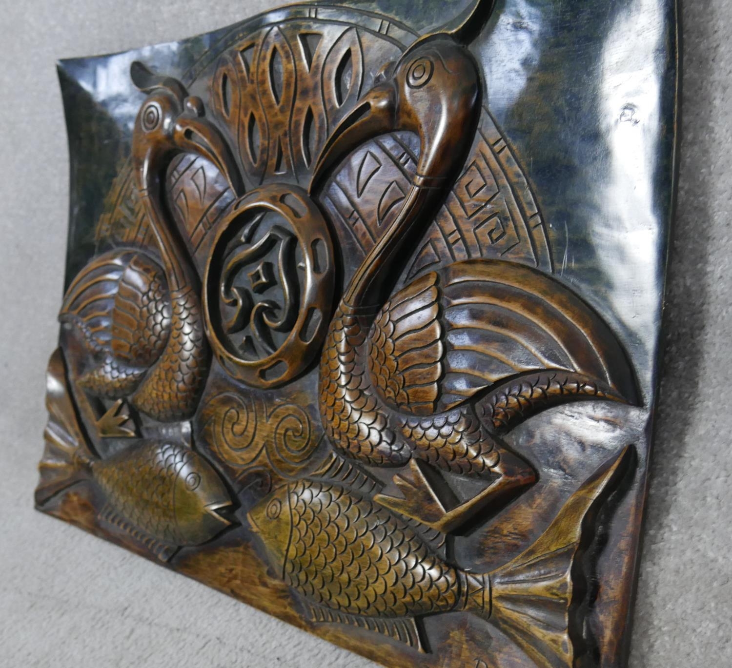 A set of three Eastern carved hardwood panels decorated with birds and fish. H.41 W.60cm - Image 4 of 8