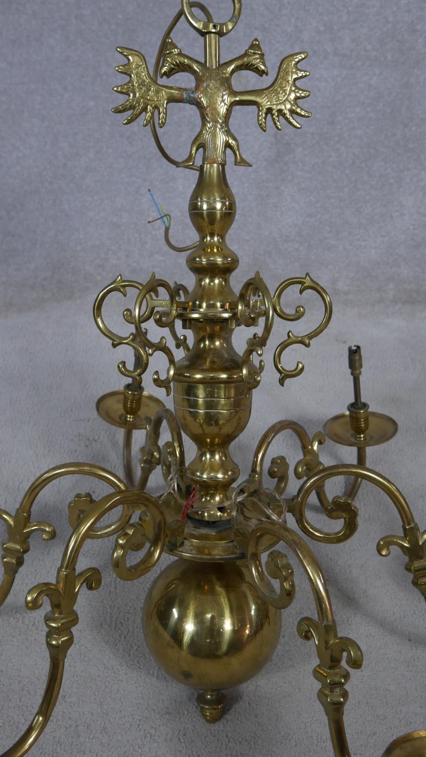 A Dutch style brass six branch chandelier with double headed eagle finials and scrolling arms. D. - Image 2 of 7