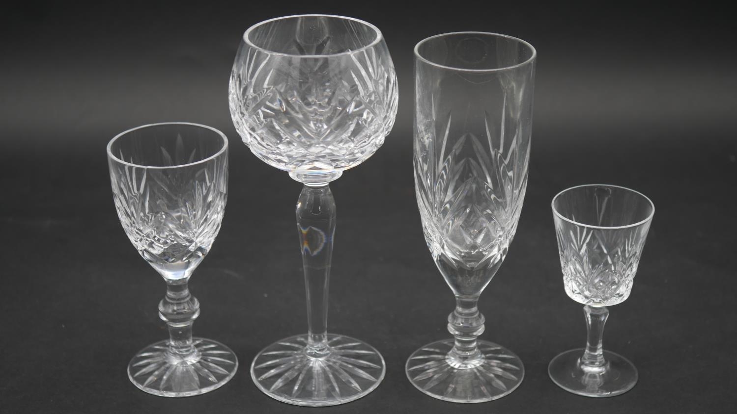 A collection of sixteen cut crystal glasses. Including a set of four foliate design wine glasses, - Image 2 of 11