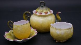 A Continental porcelain tea service of glazed floral and lemon peel design to include; teapot, cup
