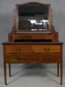 An Edwardian mahogany and satinwood with ebony strung dressing chest fitted with bevelled swing