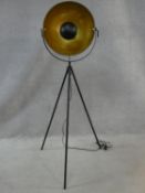 A retro styled tripod floor standing spotlight lamp with enamel interior and gold foil detail. H.