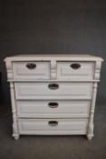 A late 19th century white painted Continental chest of two short over three long drawers. H.