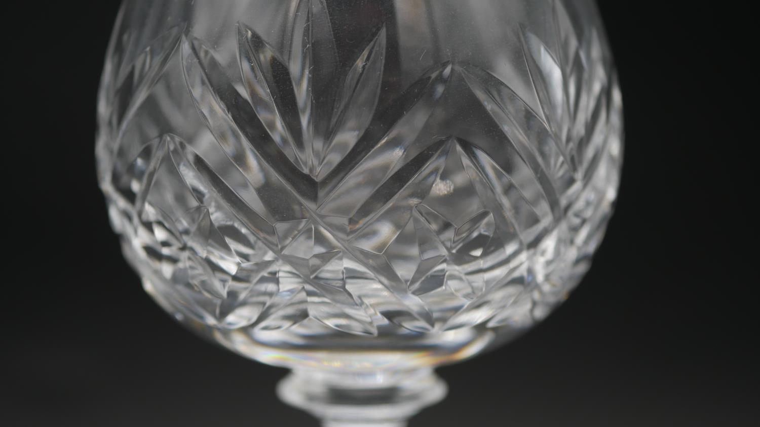 A collection of sixteen cut crystal glasses. Including a set of four foliate design wine glasses, - Image 4 of 11
