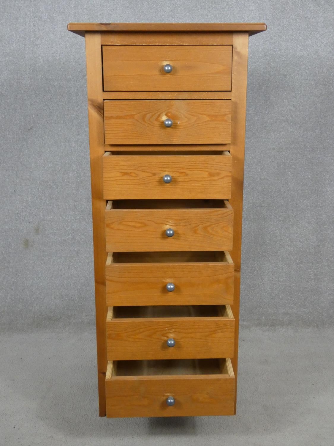 A contemporary pine narrow chest of seven drawers. H.120 W.52 D.42cm - Image 2 of 12