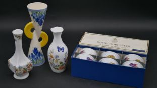 A boxed set of Royal Worcester Evesham porcelain ramekins, two Aynsley Cottage Garden design vases