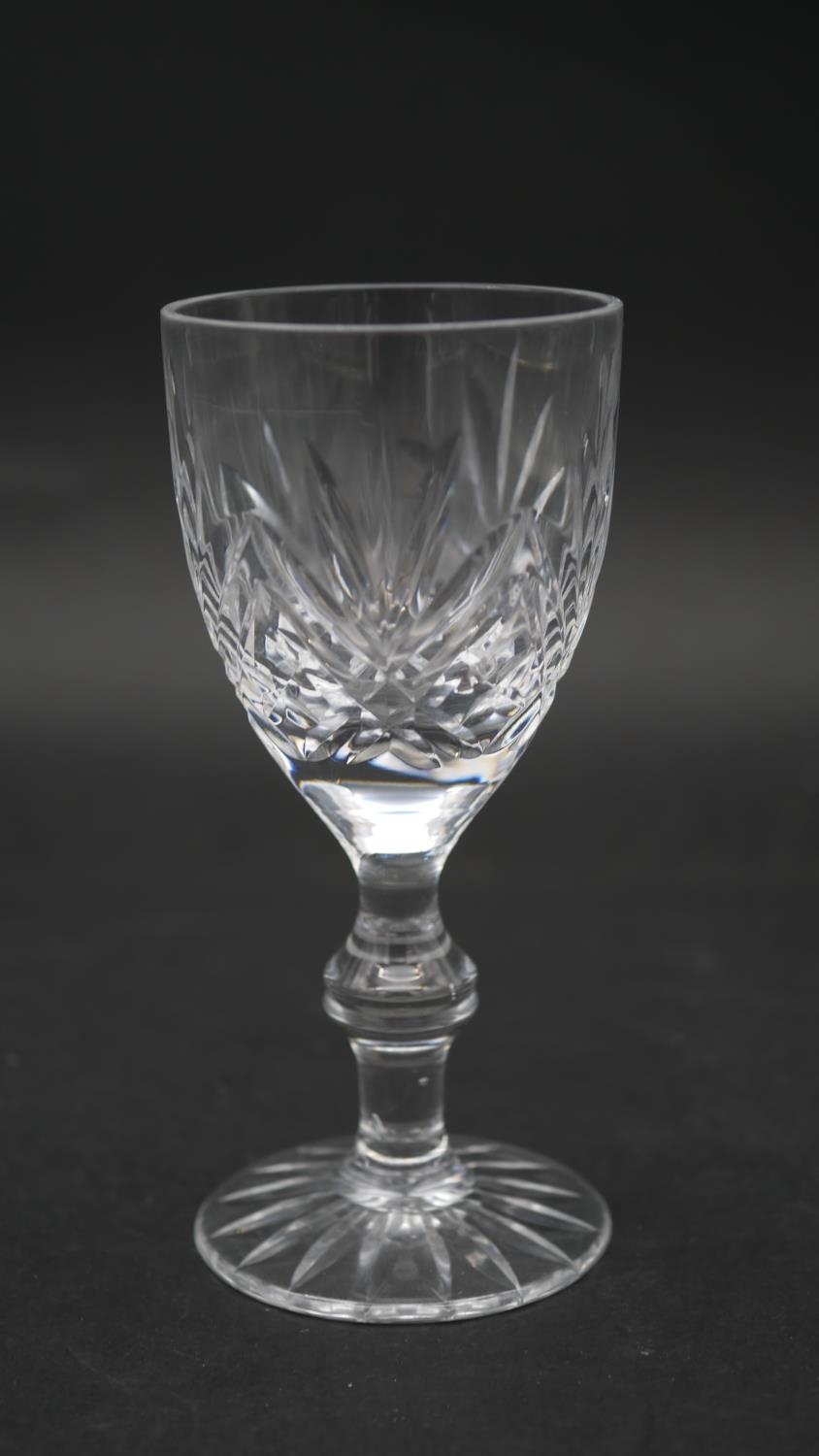 A collection of sixteen cut crystal glasses. Including a set of four foliate design wine glasses, - Image 7 of 11