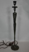 A tall Porta Romana sculpted metal lamp base. H.72cm