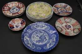 A set of four Chinese plates, a blue and white plate, a pair of Imari side plates and three other