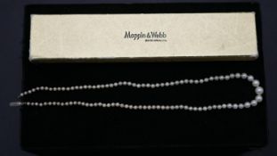 A cultured graduated pearl necklace with silver hook and push clasp with a Mappin & Webb box. L.49cm