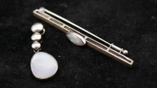 A white metal (tests as 14ct) marquise opal cabochon bar brooch with secure hinged pin to the back