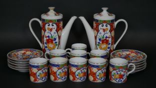A Japanese transfer printed coffee service in the Imari palette comprising two coffee pots, nine