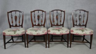 A set of four 19th century mahogany dining chairs with fan and paterae satinwood inlay to the splats