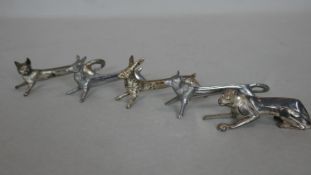 A set of five silver plated novelty knife rests in the shape of various animals. H.4.5 L.9cm