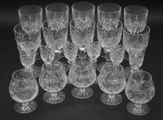 A collection of twenty one cut crystal glasses. Including ten foliate design wine glasses, five