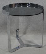 A contemporary MisuraEmme Ring bedside table by Mauro Lipparini in chrome and glass. H.51 D.50cm