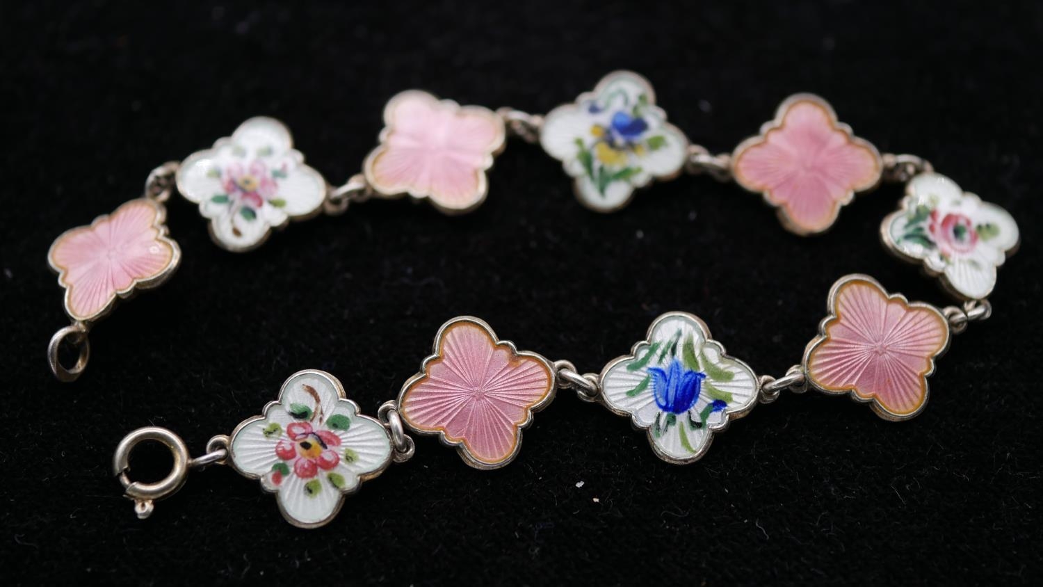 A Danish silver and guilloche enamel link bracelet. Alternating links in pink and white with various - Image 2 of 3