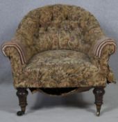 A 19th century tub armchair in buttoned floral upholstery on mahogany turned tapering supports. H.74