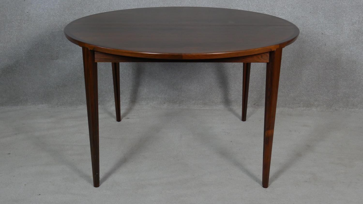 An extending dining table by Brande Mobelindustri, Denmark. H.71 L.220 W.120cm (fully extended, it