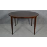 An extending dining table by Brande Mobelindustri, Denmark. H.71 L.220 W.120cm (fully extended, it