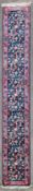 A William Morris style runner with all over Arts and Crafts design floral decoration contained by