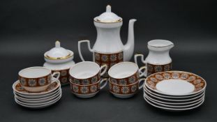 A vintage Soviet era coffee service, viz: coffee pot, milk jug, sugar bowl, cups, saucers and