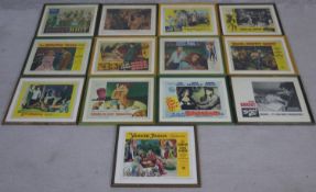 A collection of thirteen framed and glazed movie posters from the golden age of Hollywood. H.35 W.