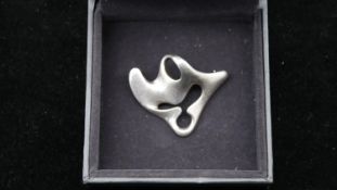 A Georg Jensen sterling silver Amoeba brooch designed by Henning Koppel. With secure hinged pin to