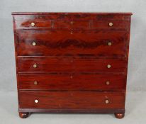 A 19th century chest with three bijouterie drawers above a flame mahogany and crossbanded deep