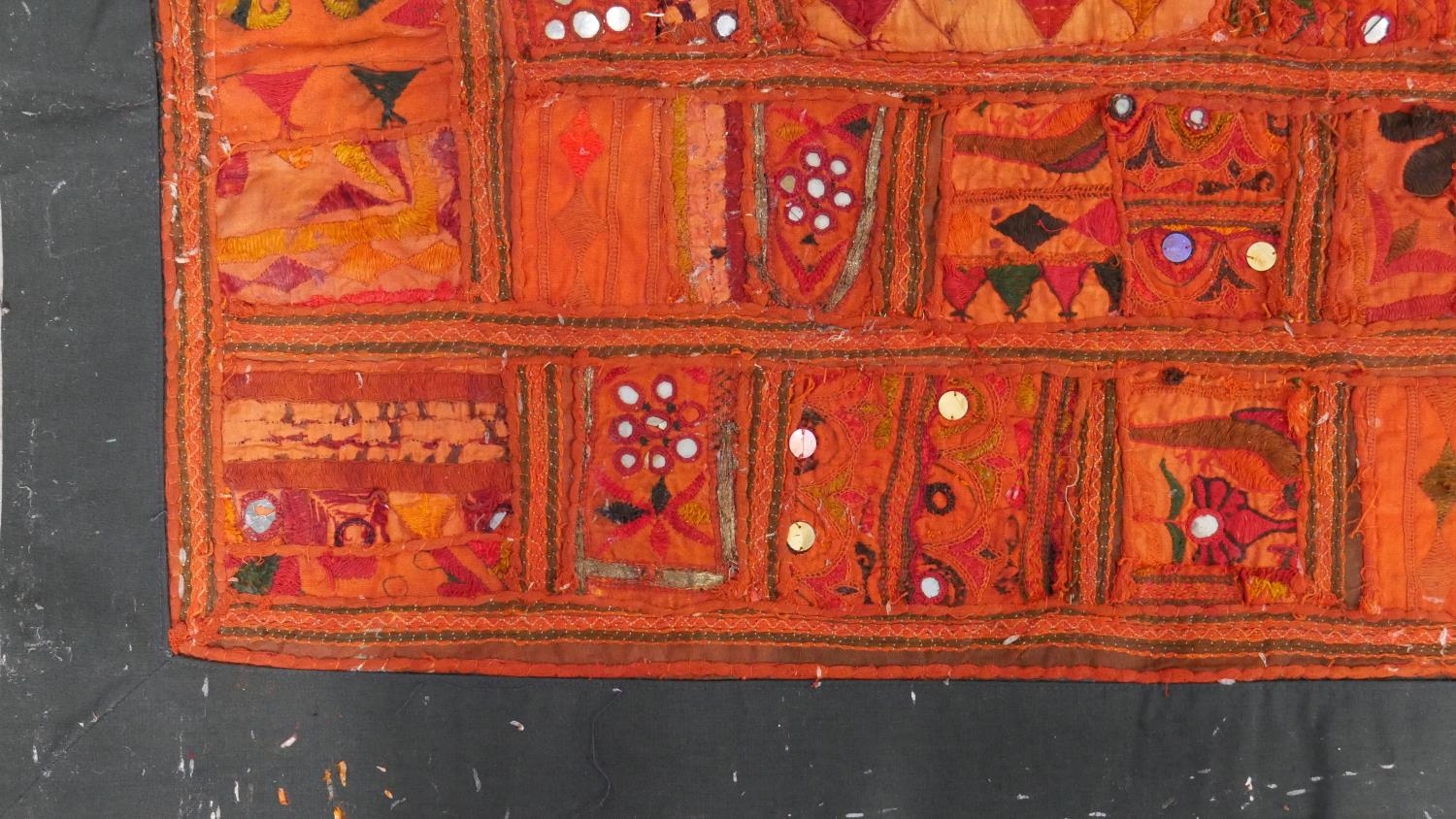 An Eastern bed covering or wall hanging with patchwork style design inset with mirrored discs. L.218 - Image 3 of 6