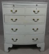 A Georgian style white painted bowfronted chest of drawers with brushing slide and brass swan neck