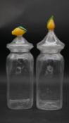 A pair of large Art Glass preserve jars with lemon finials to the lids. H.40cm