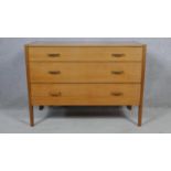 A mid century teak Heal's chest of drawers with Heal's exclusive design label. H.72 W.99 D.45cm