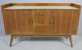 A mid century vintage teak Whiteleaf, Goodearl-Risboro sideboard with maker's label to the inside.