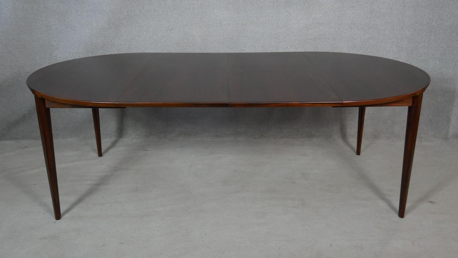 An extending dining table by Brande Mobelindustri, Denmark. H.71 L.220 W.120cm (fully extended, it - Image 2 of 5