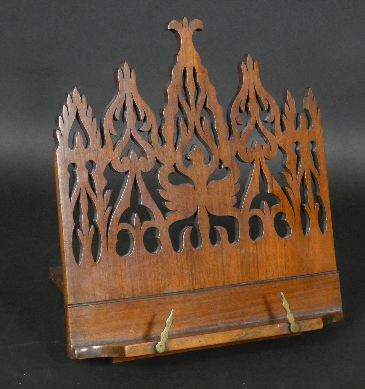 A Victorian mahogany adjustable table book or manuscript stand with Gothic pierced decoration. H.