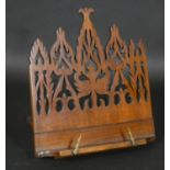 A Victorian mahogany adjustable table book or manuscript stand with Gothic pierced decoration. H.