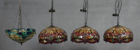 A set of three Tiffany style ceiling light pendant shades in coloured leaded glass with dragonfly
