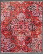A contemporary design Persian style woollen carpet with large central medallion on a rouge field