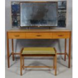 A mid century vintage teak Heal's dressing table and matching dressing stool with Heal's exclusive