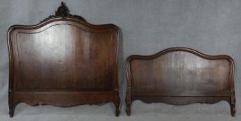 A French Rococo carved bedstead. (side rails missing). H.154 W.151cm