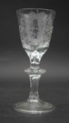 A Georgian wine glass with engraved coat of arms. H.14.5cm