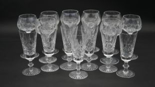 A collection of cut Edinburgh crystal glasses. Including a set of eight foliate design wine