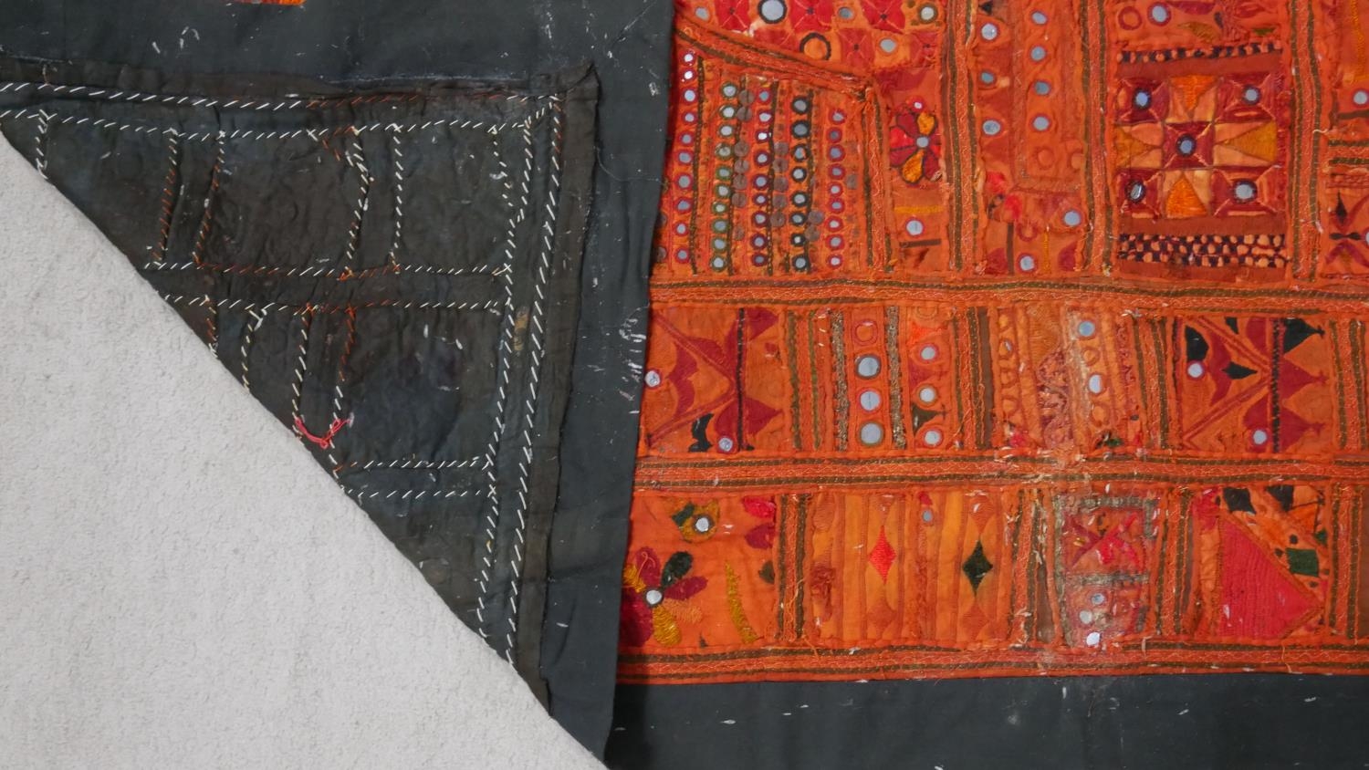 An Eastern bed covering or wall hanging with patchwork style design inset with mirrored discs. L.218 - Image 6 of 6