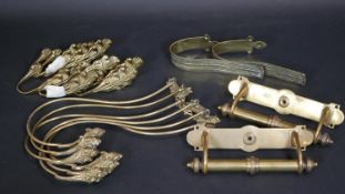 A pair of Victorian brass door handles along with various brass hooks and curtain fittings. 37cm