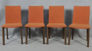 A set of four dining chairs by Skovby of Denmark in tangerine upholstery. H.89cm