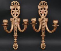 A pair of carved giltwood and gesso twin branch wall sconces with swag and ribbon detail. H.47.5 W.